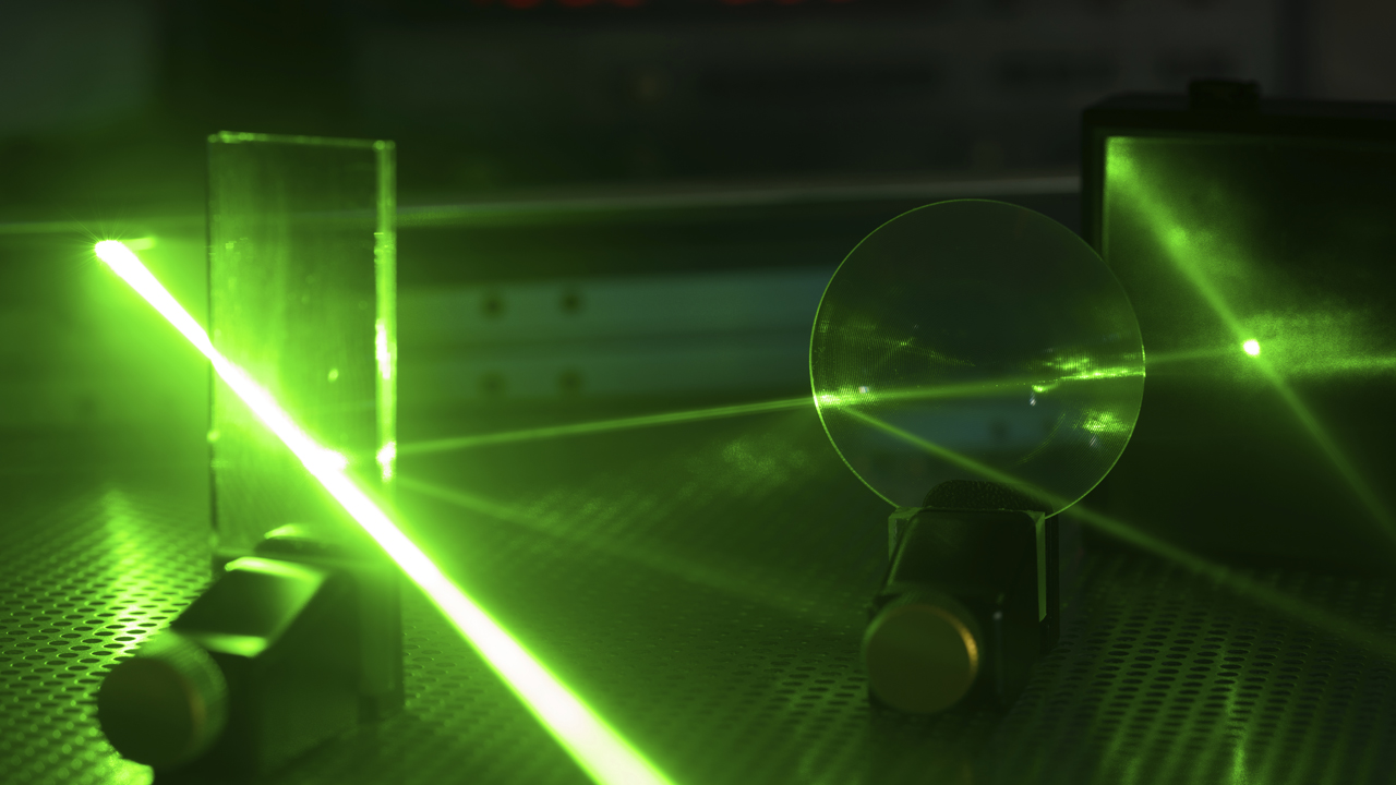 Laser experiment in photonics laboratory.