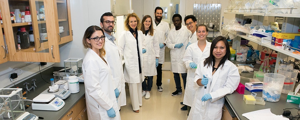 Neuroscience Initiative Director Patrizia Casaccia with faculty and students in a neuroscience lab at the ASRC