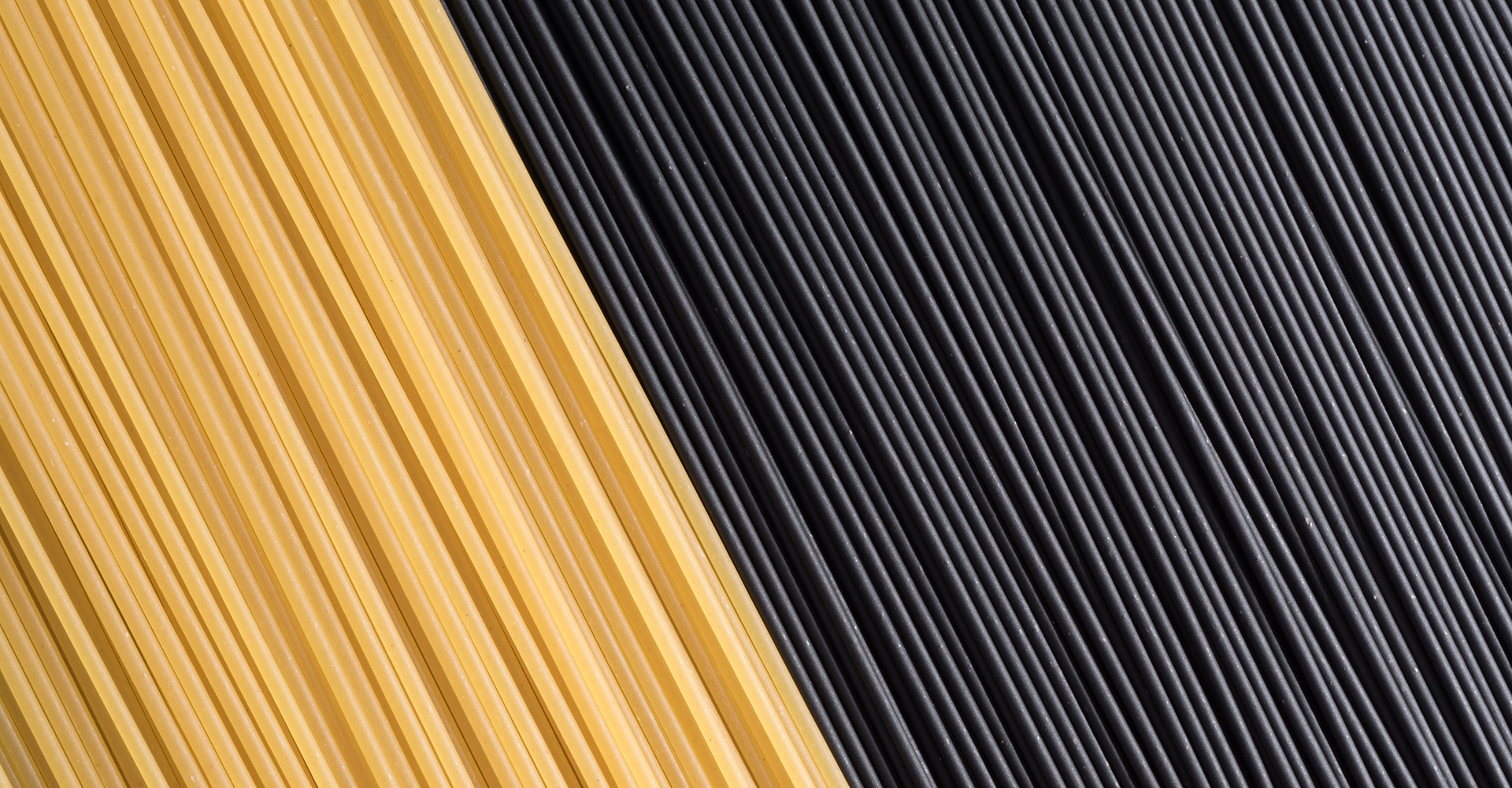 Uncooked Squid ink Spaghetti and Yellow Spaghetti Full Frame Shot, Directly Above View.