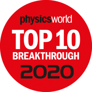White and black text on a red circular background reading "physics world top 10 breakthrough 2020"